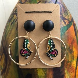 Butterfly Circle Gold-tone w/Black accent.